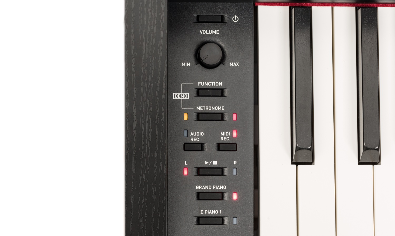 Левый край клавиатуры Casio PX-870 крупным планом: белые клавиши с матовой фактурой под слоновую кость, чёрные — под эбен, рядом панель с регулятором громкости и кнопками FUNCTION, METRONOME, AUDIO REC